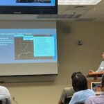 Figure: ESSIC/CISESS Scientist Christopher Smith presenting his research as the Enterprise Proving Ground Satellite Liaison for the NWS Weather Prediction Center (WPC) and Ocean Prediction Center (OPC) to maximize satellite capabilities for weather forecasts.